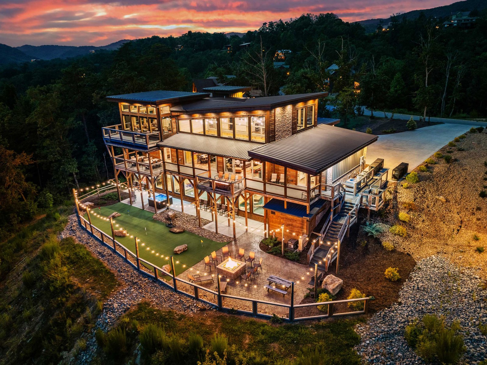 Three-story Sevierville cabin lit at dusk