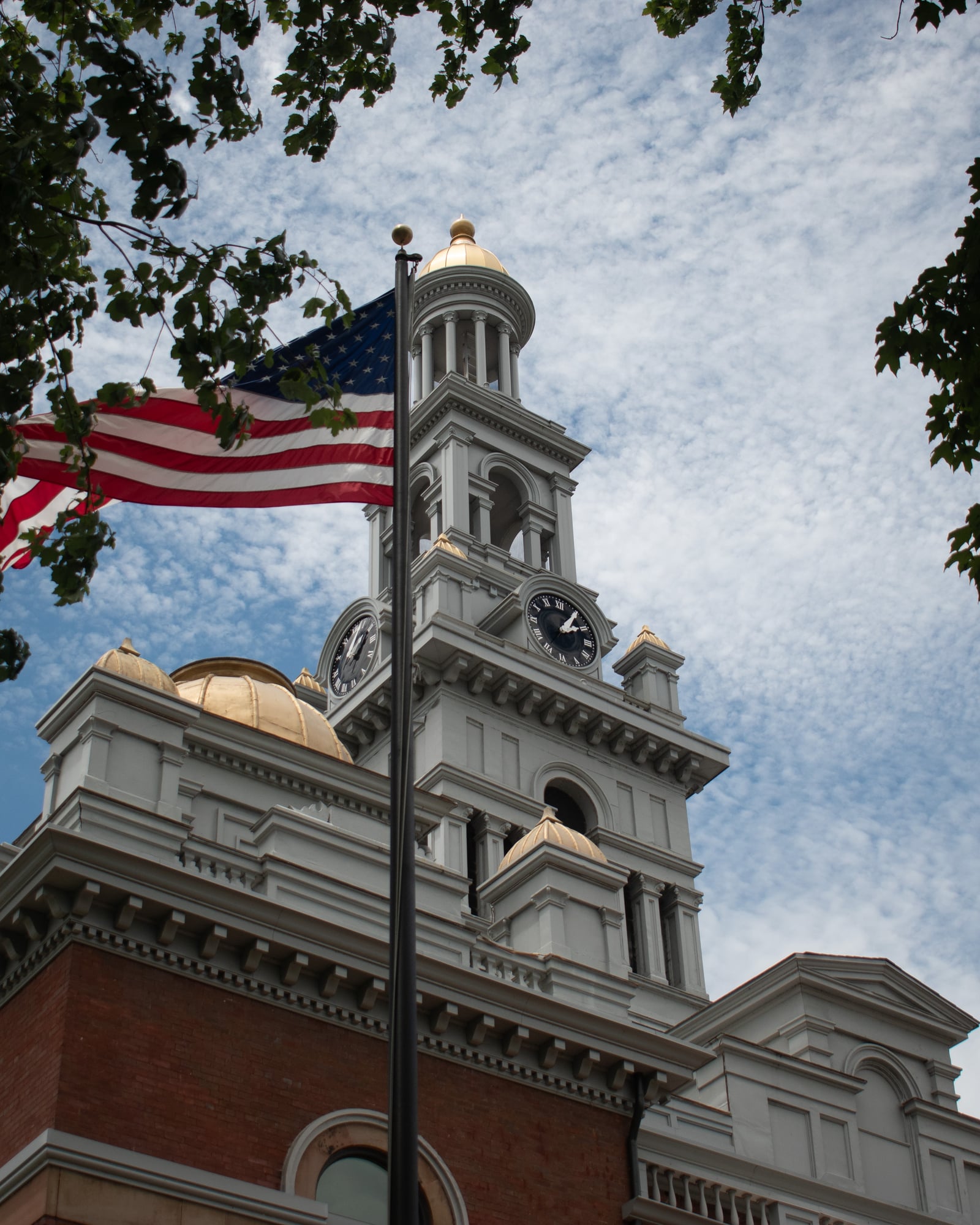 Sevier County Courthouse clock tower and United States flag in Sevierville